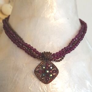 AVON purple beaded three strand necklace with crystal set pendant